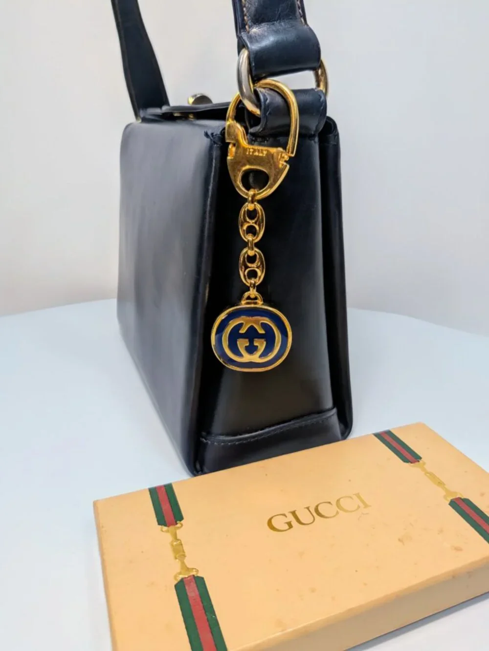 Gucci Vintage Gold Tone GG Logo Embossed Circle Bag Charm